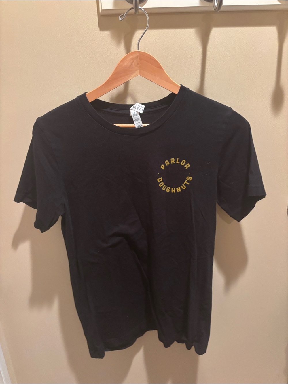 Bella Canvas Black Short Sleeve Tee with Yellow 'Parlor Doughnuts' Logo